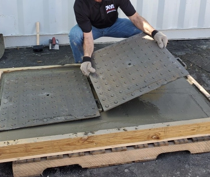 “CastIron tactile paving installation process showing durable cast-in-place panels with raised domes for ADA-compliant pedestrian safety on sidewalks.