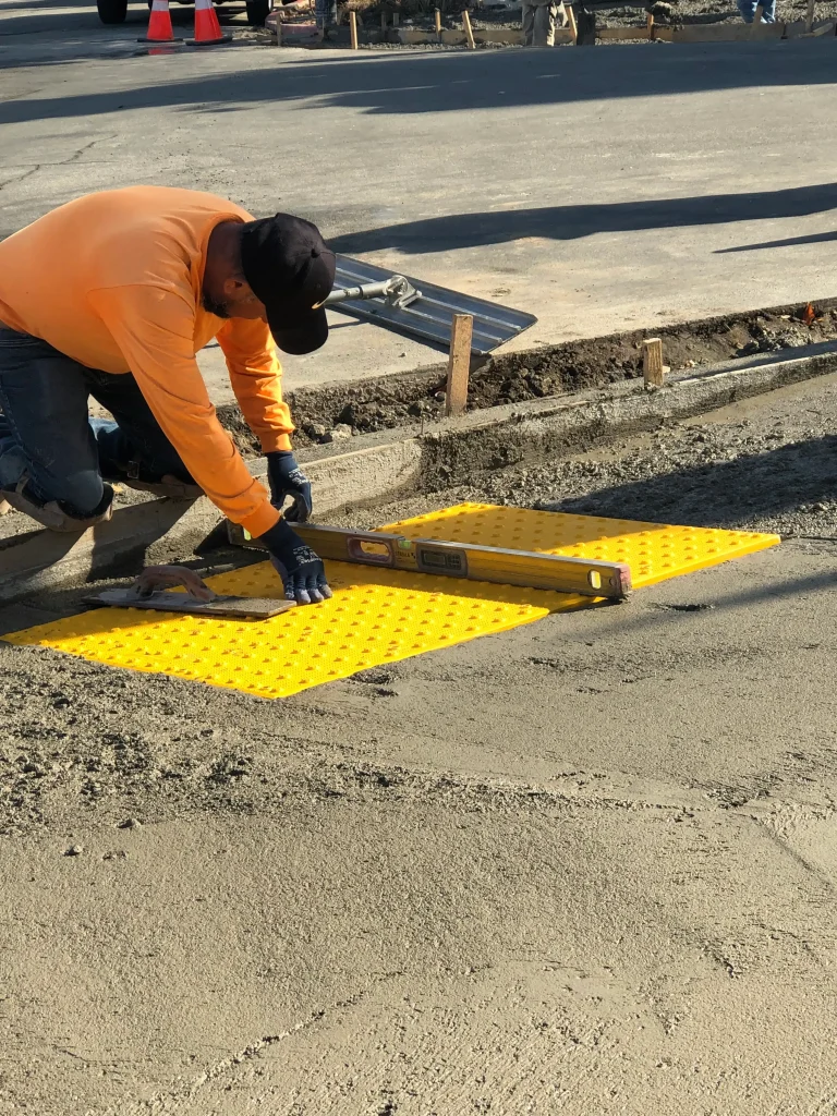 Parking structure with ADA-compliant pedestrian path