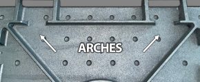 Close-up of structural component with textured surface and circular holes, featuring highlighted arches for reinforcement in design.