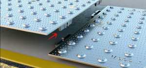 After setting the first plate down do not fully imbed in the concrete. Take the next plate and install by putting the tabs on the bottom into the arches.