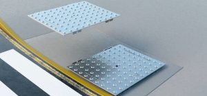 When adjacent plates are installed, ensure that the side with the two arches that extend outside the panel on the bottom extends to the side where the next plate will go.
