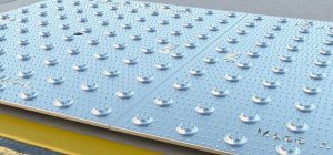Continue this process until all plates have been set onto the wet concrete.